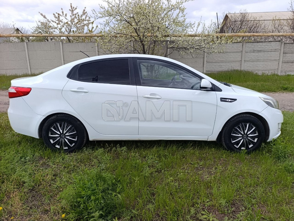 KIA Рио 2014  - изображение 7