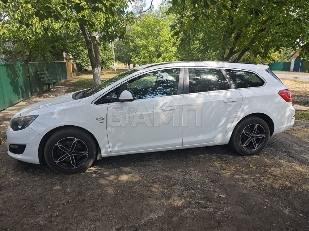 Opel Astra 2014  - изображение 5